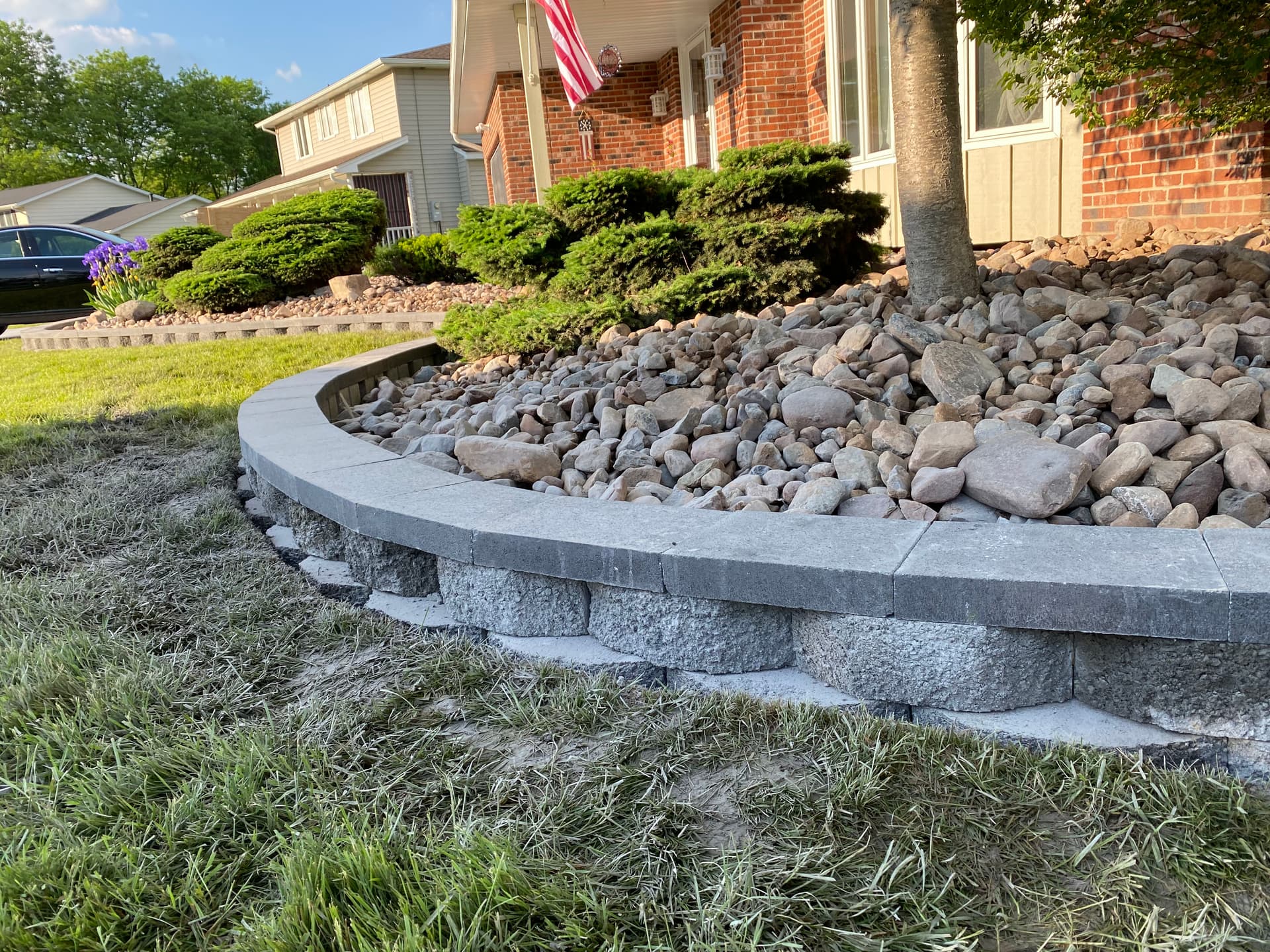 Elegant Lawn Upgrade with Stone Beds and Mulch Edging