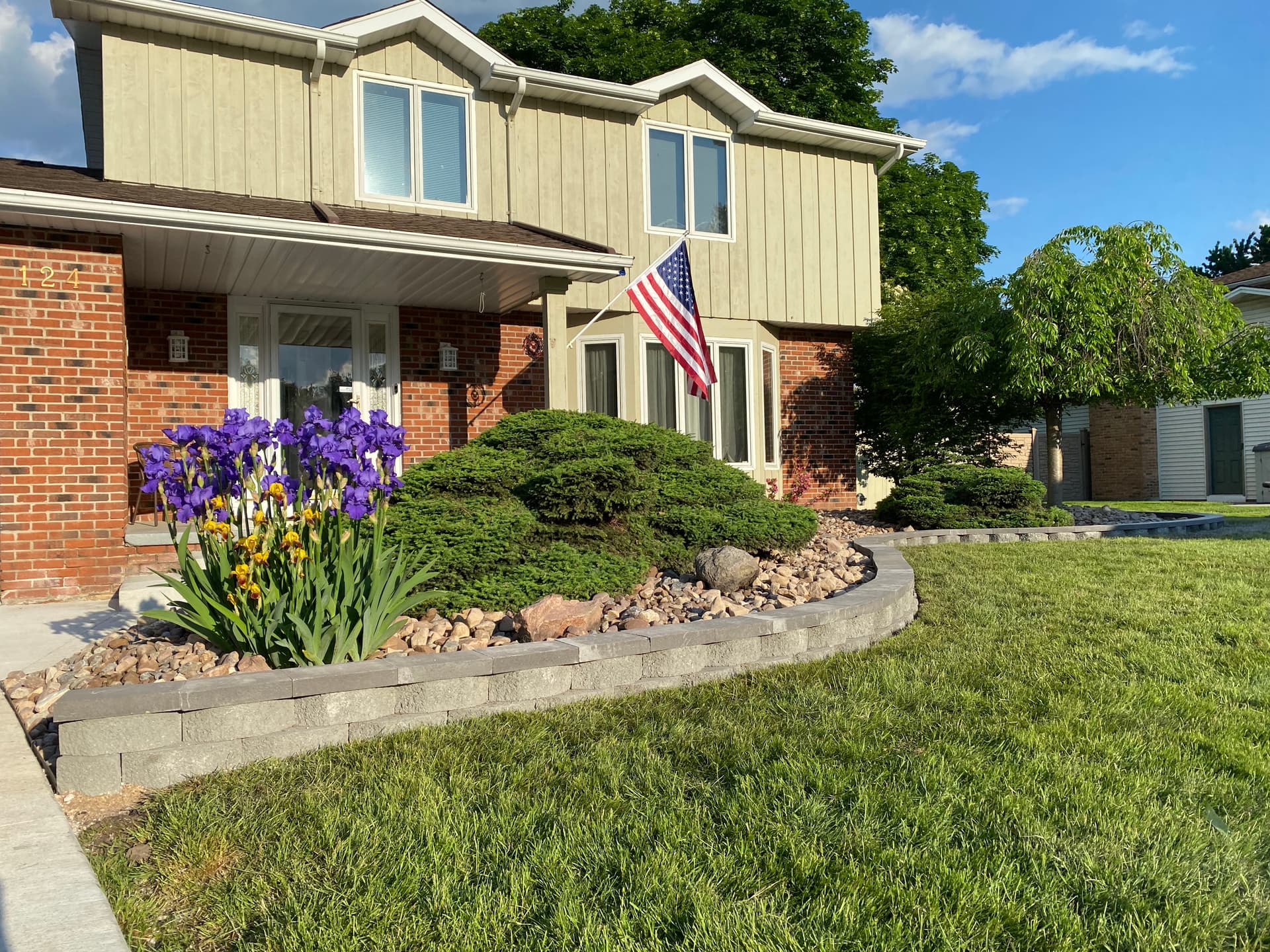 Elegant Lawn Upgrade with Stone Beds and Mulch Edging