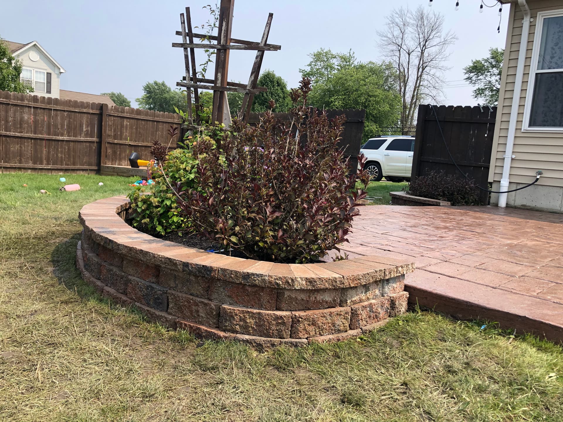 Gallery photos for Beautiful Backyard Enhancement with Retaining Walls and Patio: Image #1