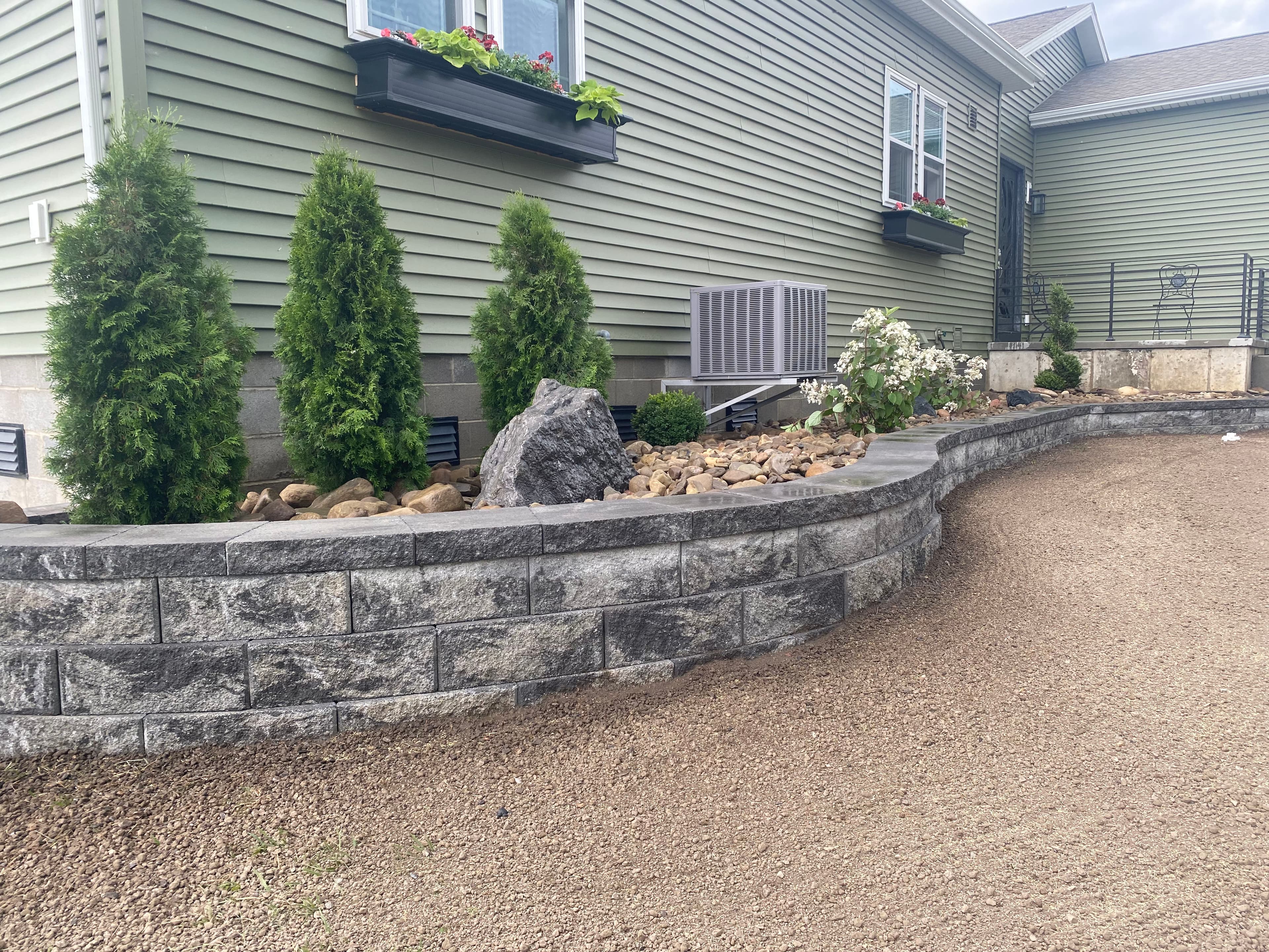 Project Transforming Outdoor Space with a Stunning Retaining Wall and Grading image