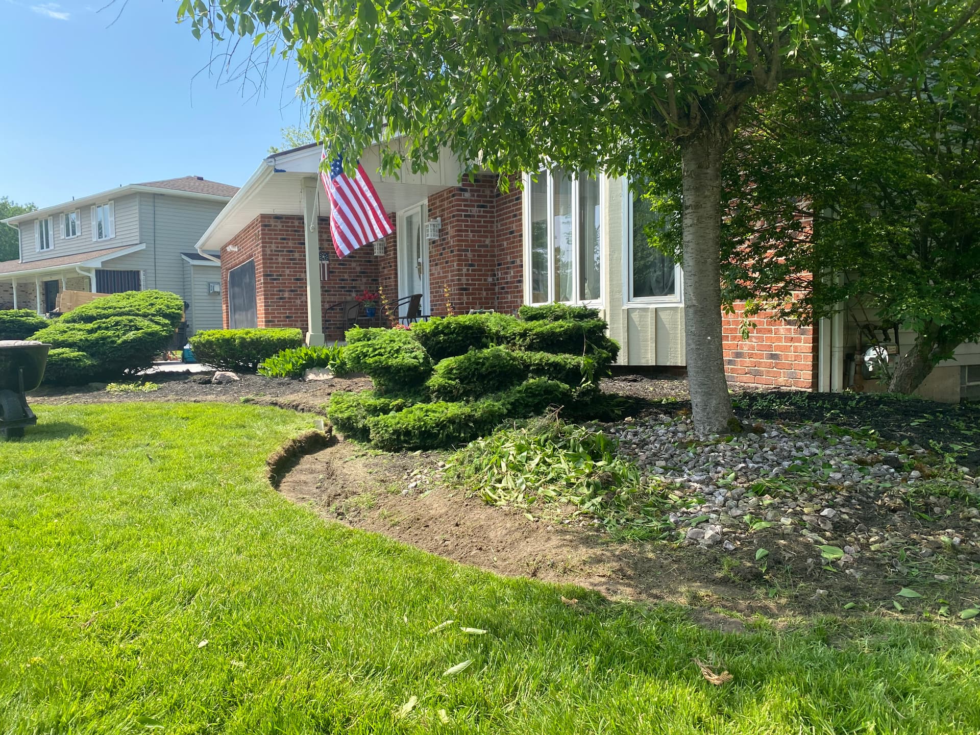 Elegant Lawn Upgrade with Stone Beds and Mulch Edging