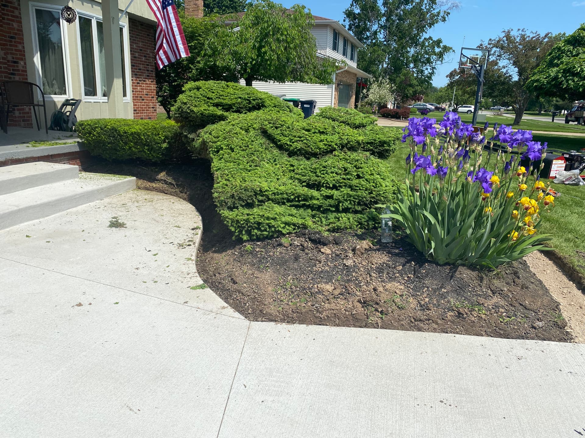 Elegant Lawn Upgrade with Stone Beds and Mulch Edging