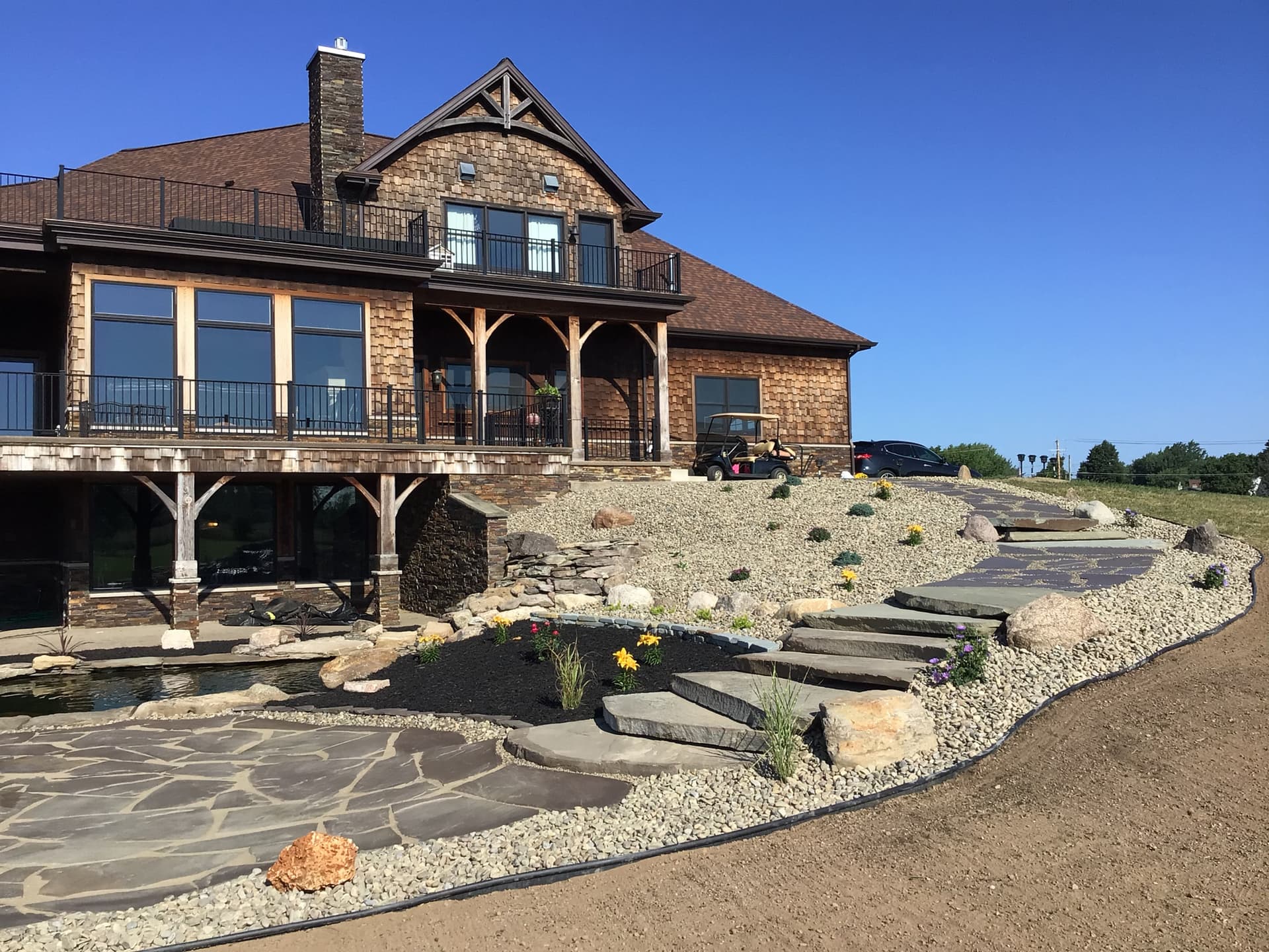 Stunning Outdoor Spaces with Flagstone and Custom Landscaping image