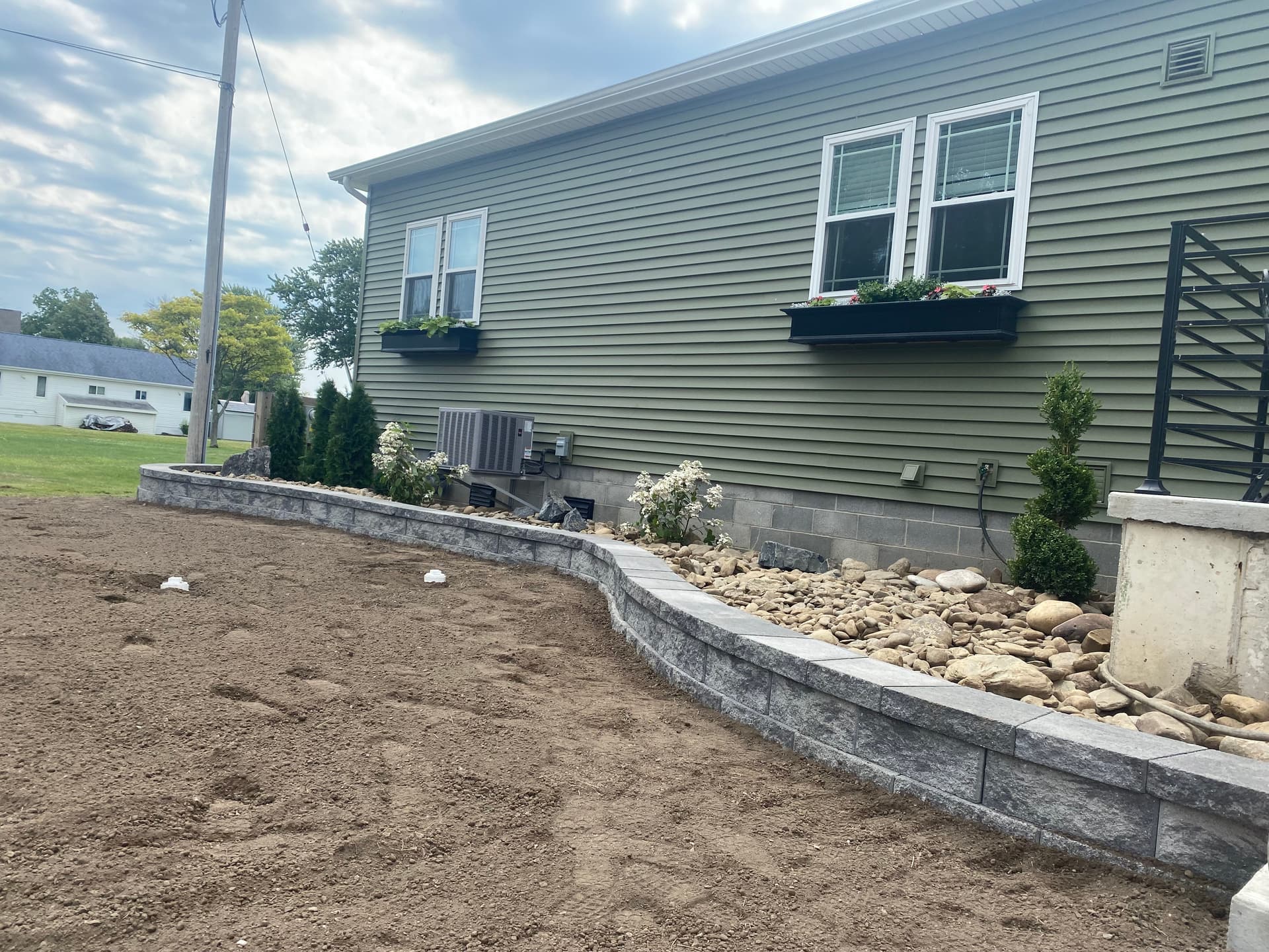 Gallery photos for Transforming Outdoor Space with a Stunning Retaining Wall and Grading: Image #2