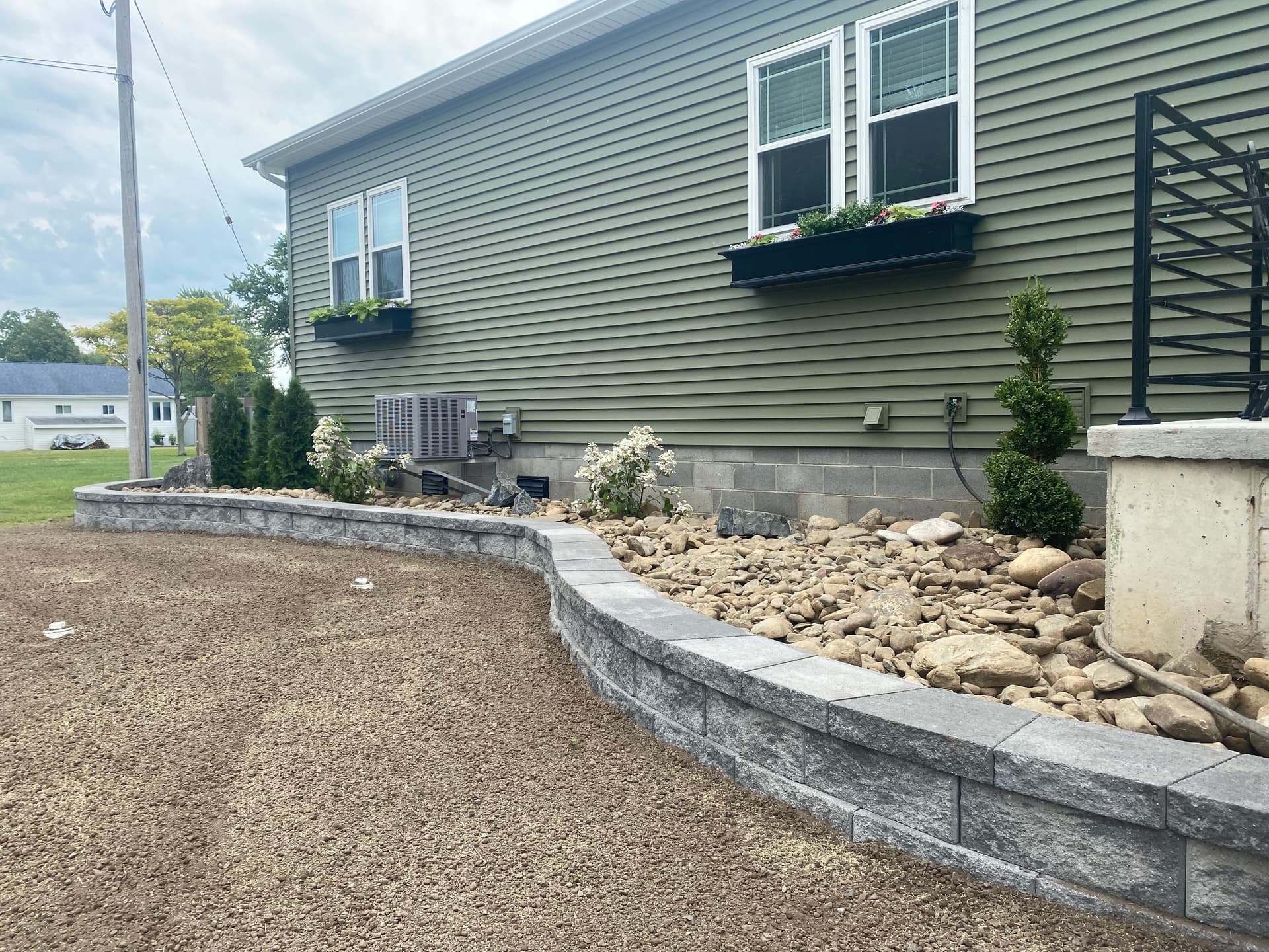 Gallery photos for Transforming Outdoor Space with a Stunning Retaining Wall and Grading: Image #1
